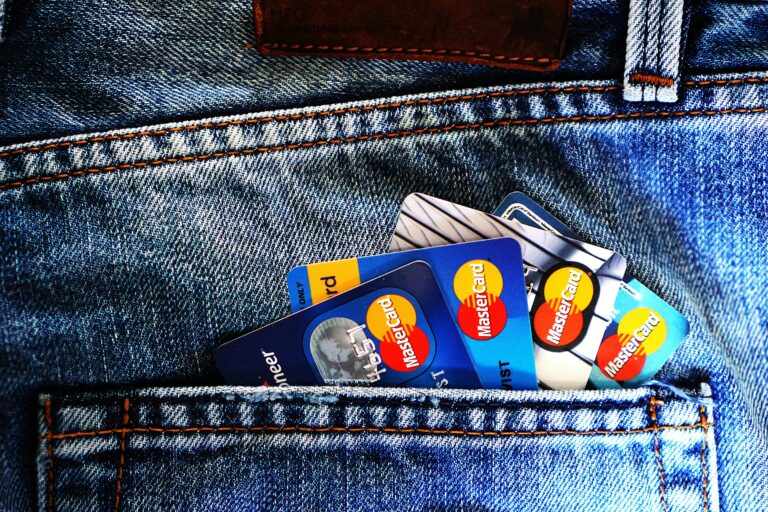 credit report and calculator representing credit score requirements to buy a house in Oklahoma