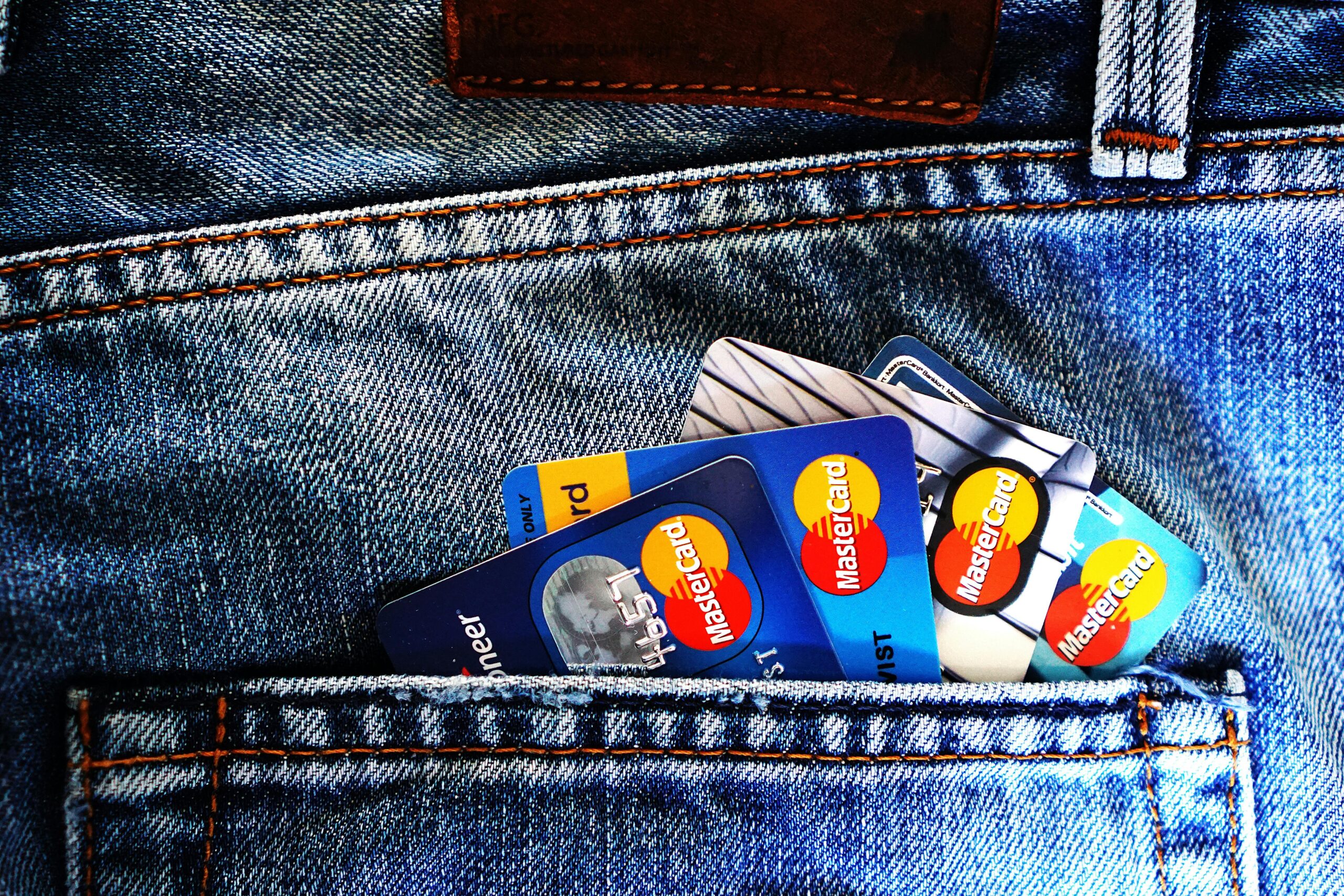 credit report and calculator representing credit score requirements to buy a house in Oklahoma