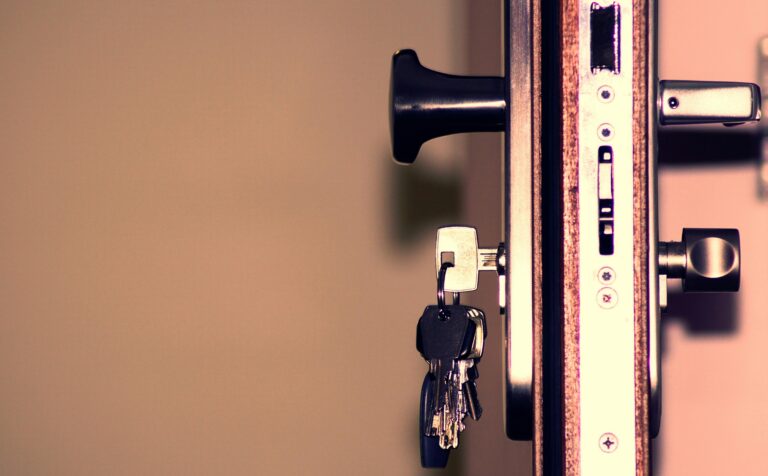 House keys with house shaped keychain representing first time home buyer programs in Oklahoma