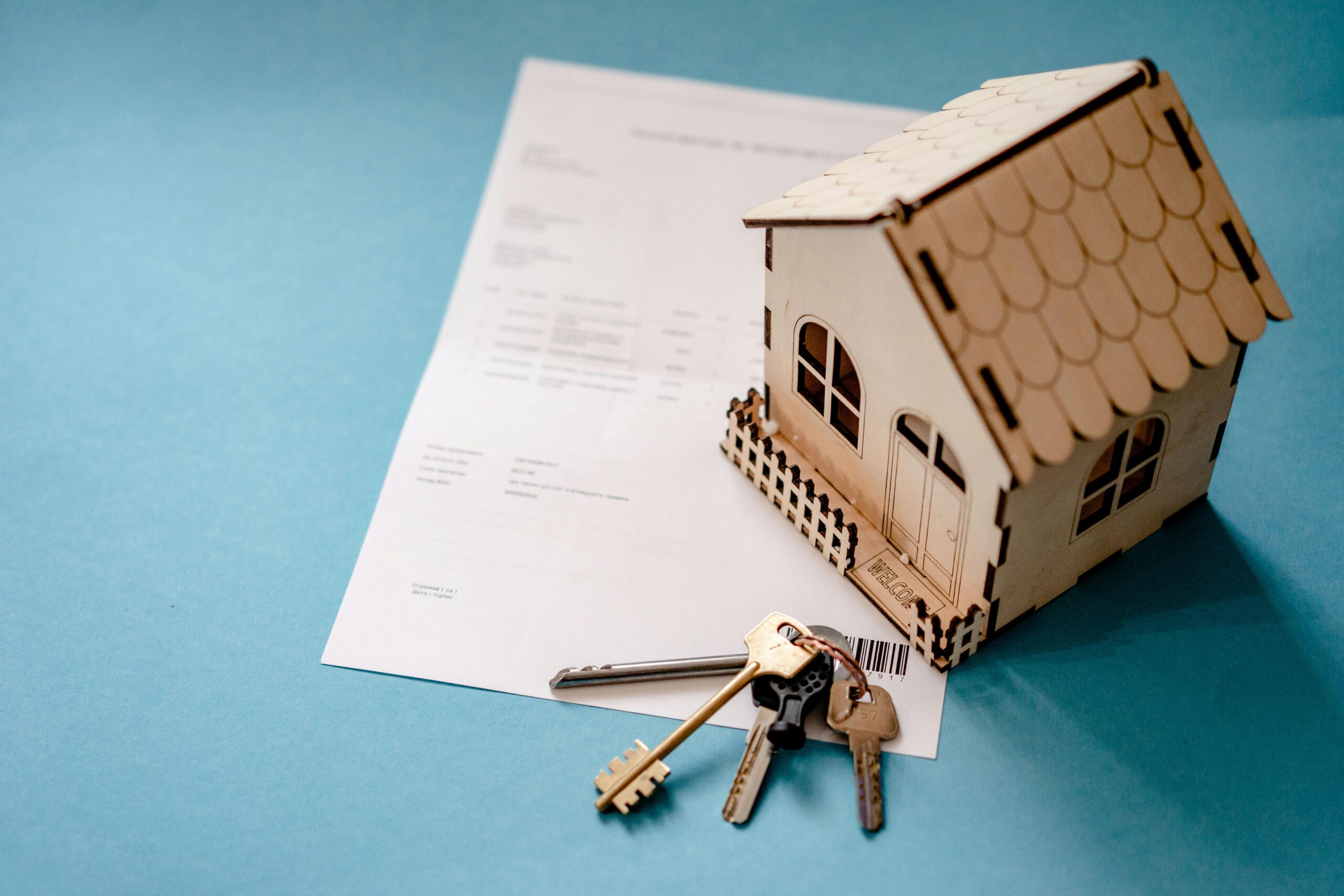 home purchase contract and pen representing making an offer on a house in Oklahoma