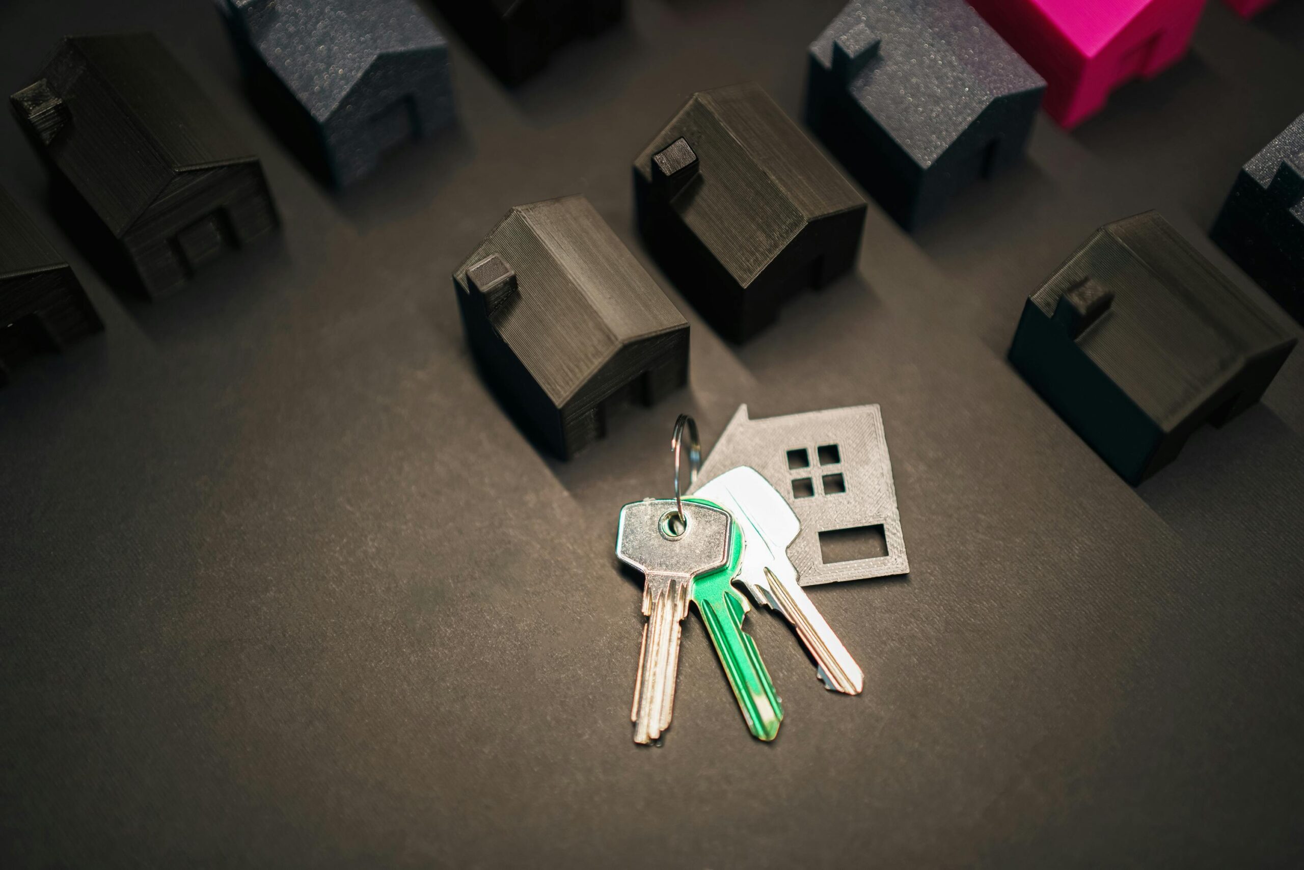 House keys on real estate purchase contract representing closing costs in Oklahoma